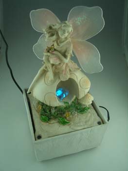 FOUNTAIN FAIRY ON MUSHROOM RED