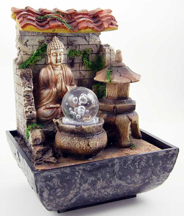 Fountain Buddha Thai Praying Next To Pagoda With Light And Rolli